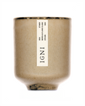 Product image of the IGNI Ether Neroli & Ylang Ylang luxury scented candle in a beige ceramic vessel, featuring a minimalist vertical label on a clean white background.